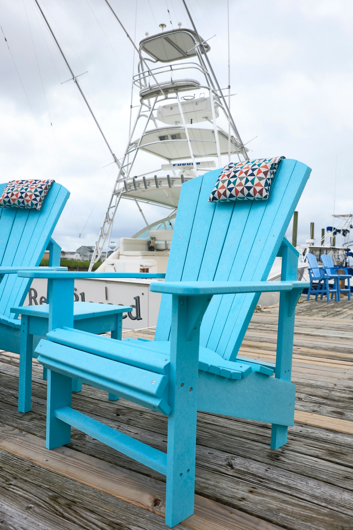 blue patio chair with headrest on dock